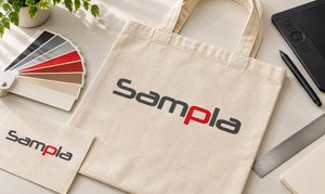 Torba bawełniana z logo Sampla, wzornik Pantone i tablet graficzny do projektowania nadruku